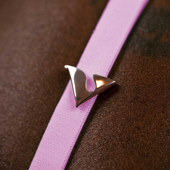 14K Rose Gold V Buckle Accessory adorned on the Taffy Virtue Strap