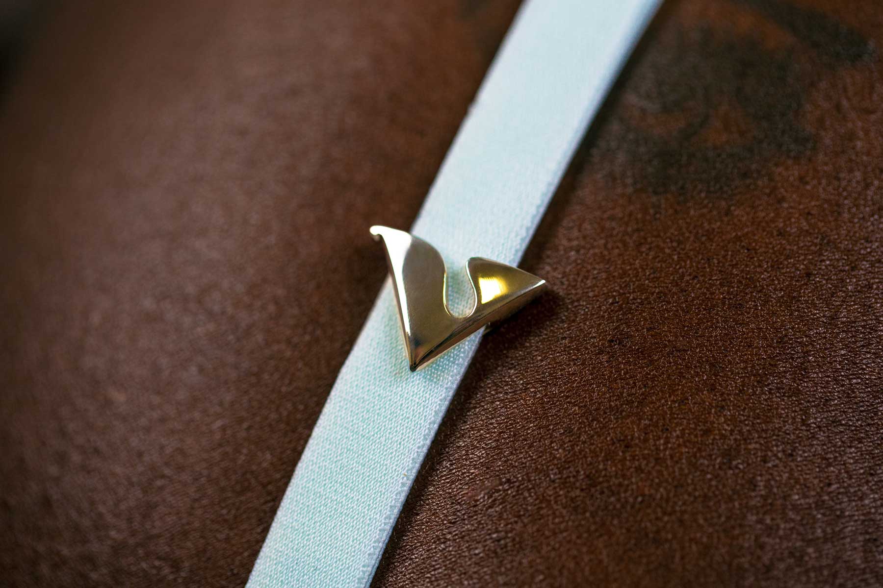 14K Yellow Gold V Buckle Accessory adorned on the Mint Virtue Strap