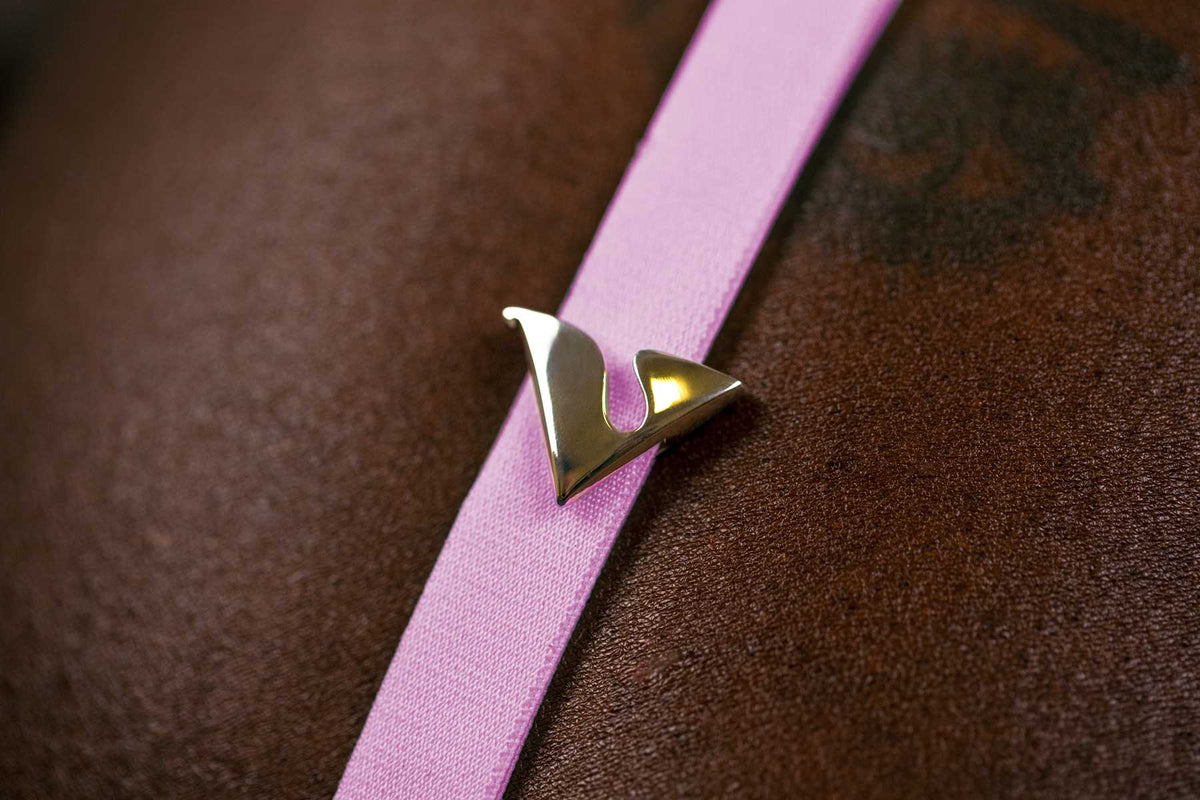 14K Yellow Gold V Buckle Accessory adorned on the Taffy Virtue Strap