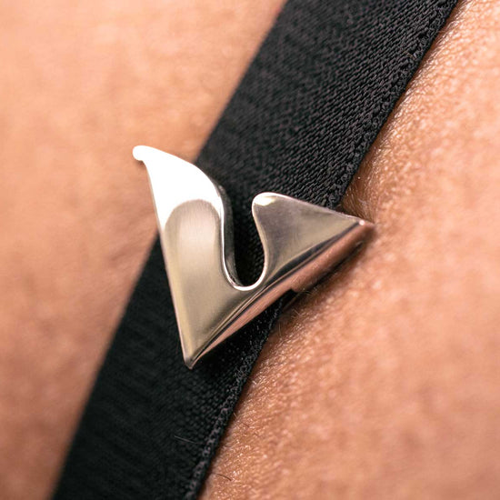 Platinum V Buckle Accessory on Black Strap CloseUp