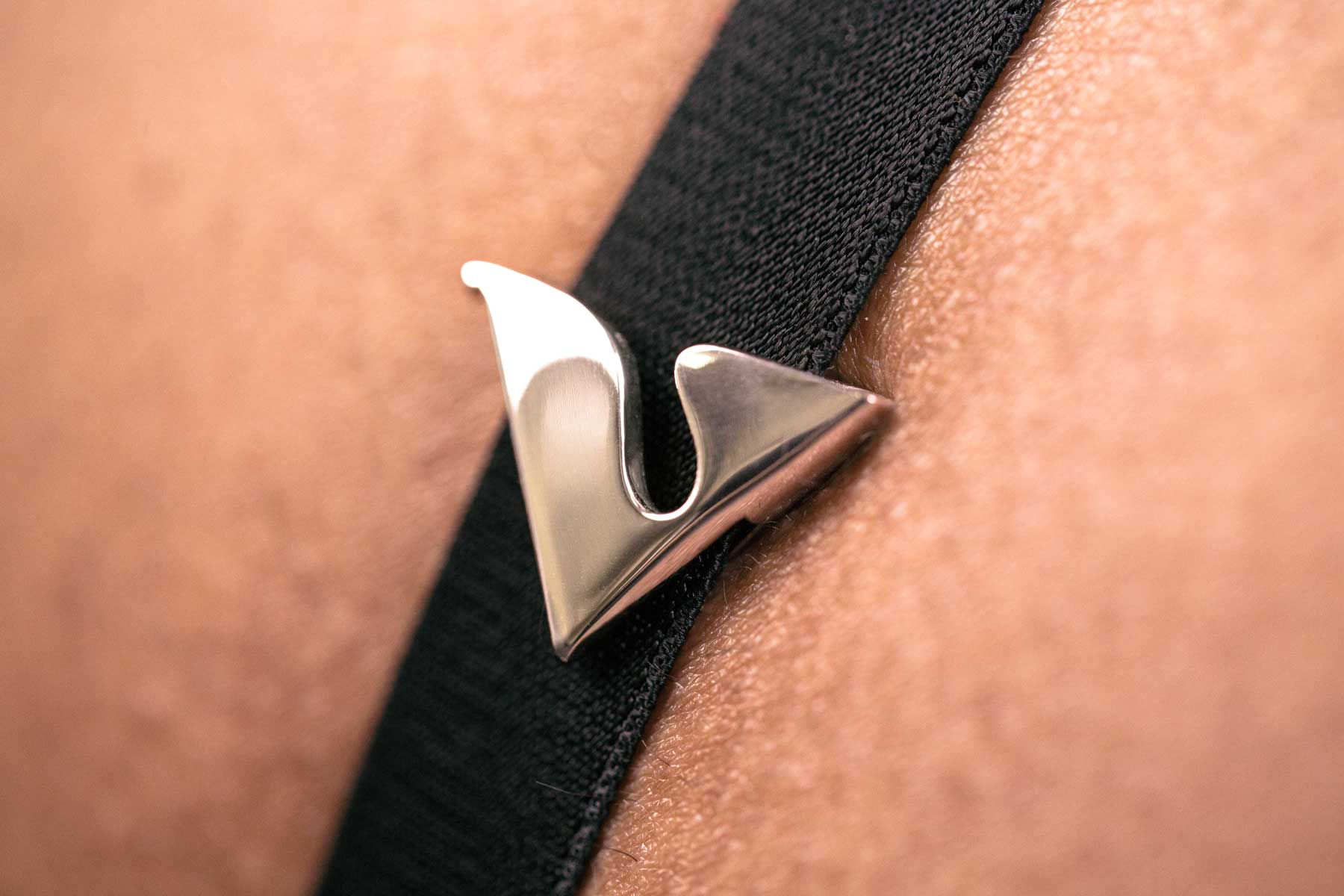 Platinum V Buckle Accessory on Black Strap CloseUp