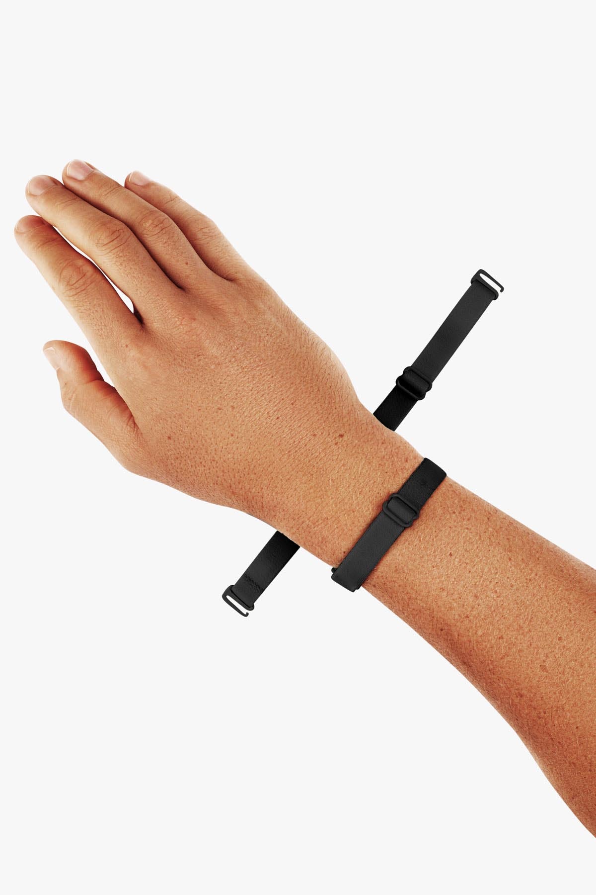 Virtue Genderless Strap Black Color Worn as Hand Cuff on Model wrist designed to be worn in different configurations strap sculpt squeeze