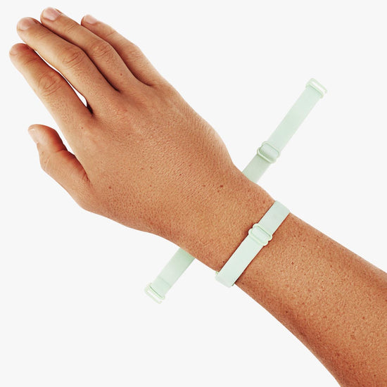 Virtue Genderless Strap Mint Color Worn as Hand Cuff on Model wrist designed to be worn in different configurations strap sculpt squeeze