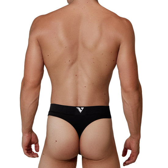 Man modeling the black Core Thong, full back view — Color: Black