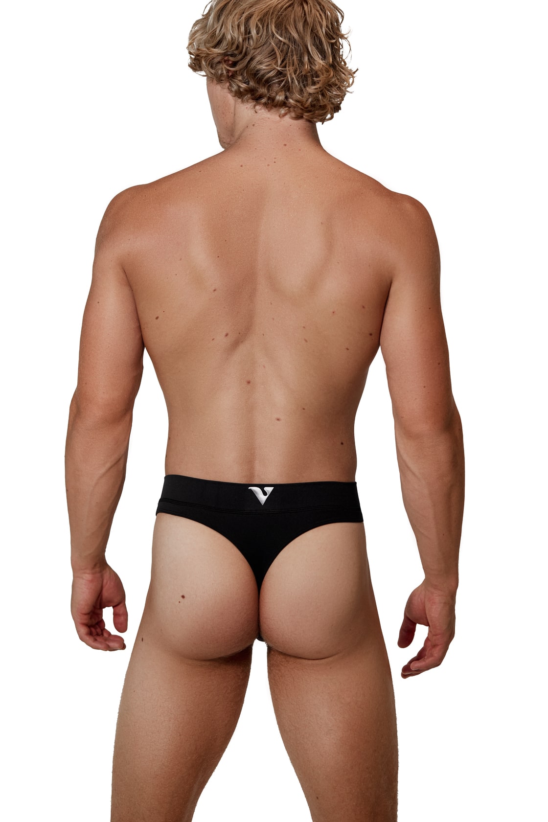 Man modeling the black Core Thong, full back view — Color: Black