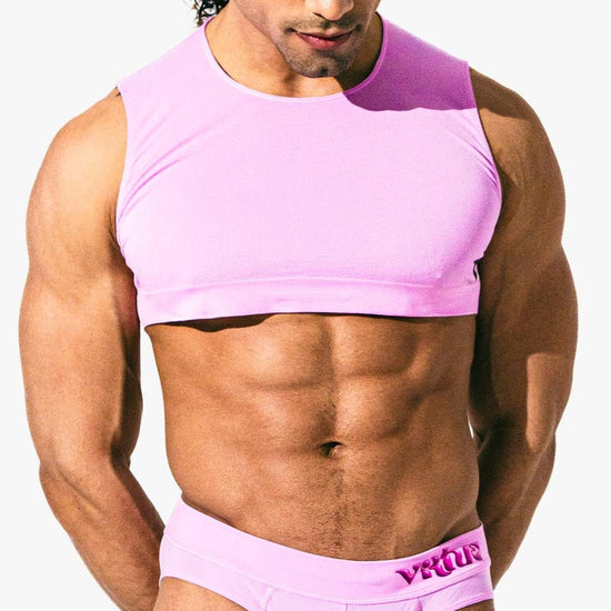 Close-up of a model wearing the taffy Mini Crop Top, front view — Color: Taffy