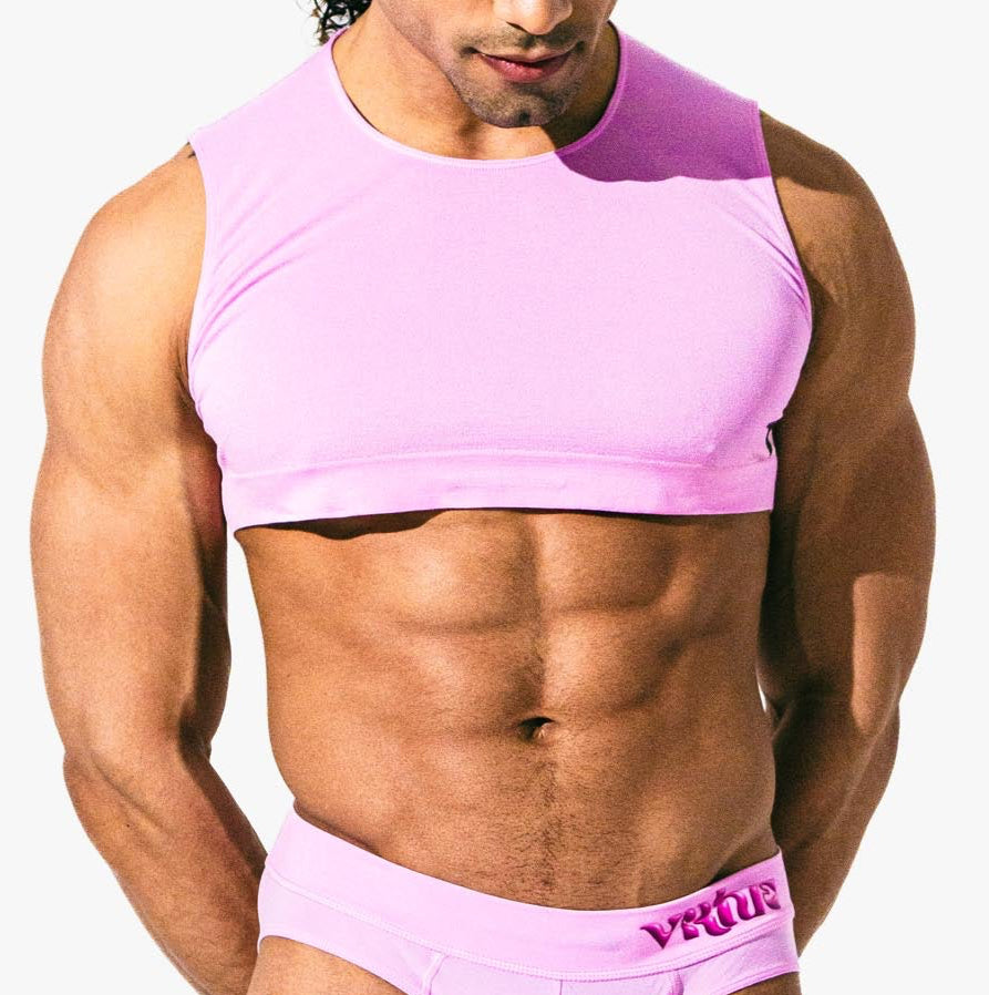 Close-up of a model wearing the taffy Mini Crop Top, front view — Color: Taffy