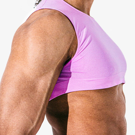 Close-up of a model wearing the taffy Mini Crop Top, side-front view — Color: Taffy