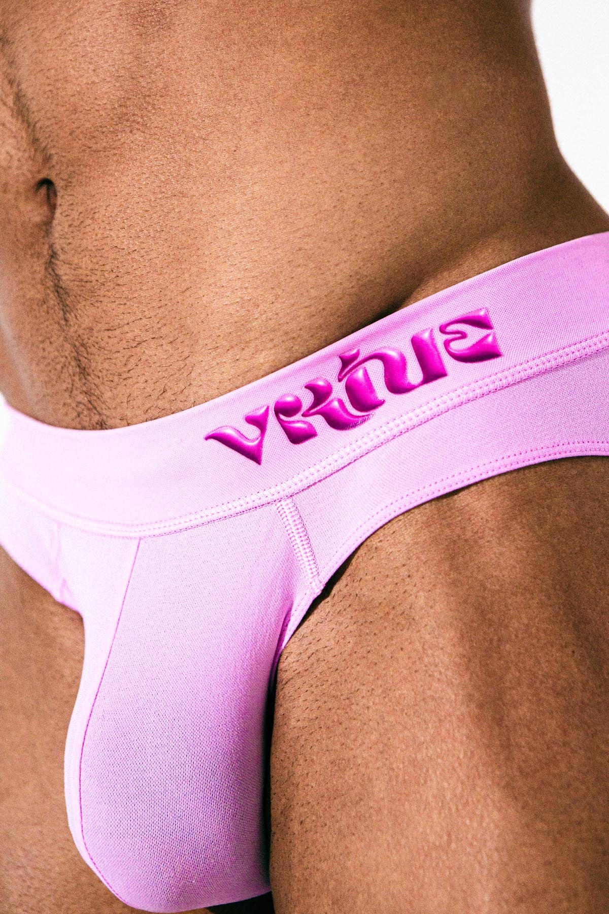 Virtue Model Mason Levant wearing Virtue Taffy Pouch Strap Closeup