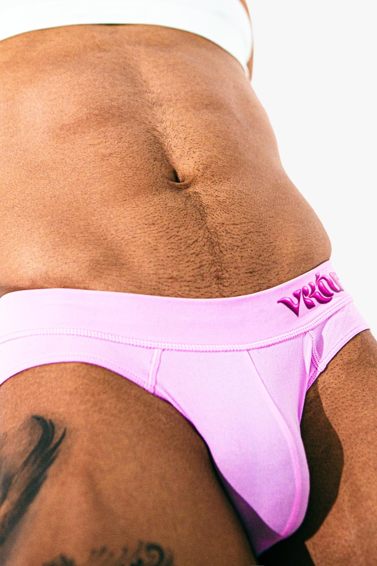 Virtue Model Mason Levant wearing Virtue Taffy Pouch Strap Detail