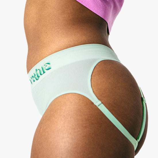 Virtue Model posing in Mint Rib Knit Compact Fit Strap Brief Side View