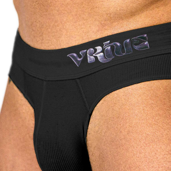 Model styling the black Sculpt Jockstrap Rib Brief, full back view — Fabric: Rib — Color: Black
