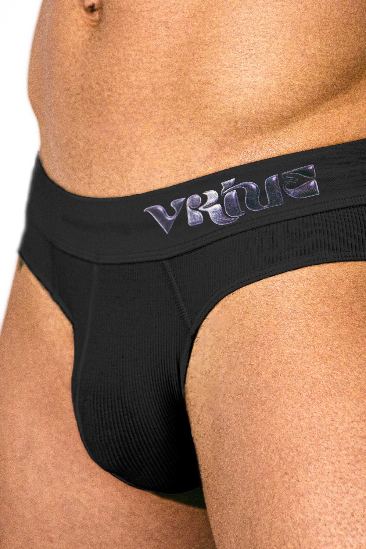 Model styling the black Sculpt Jockstrap Rib Brief, full back view — Fabric: Rib — Color: Black