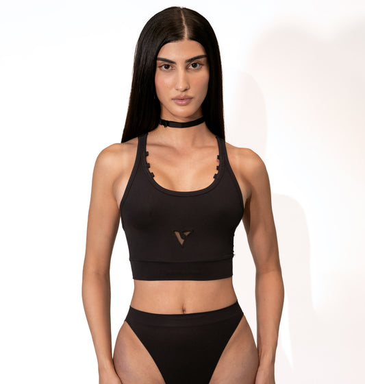 Model wearing the black Compression Crop Top, front view — Color: Black