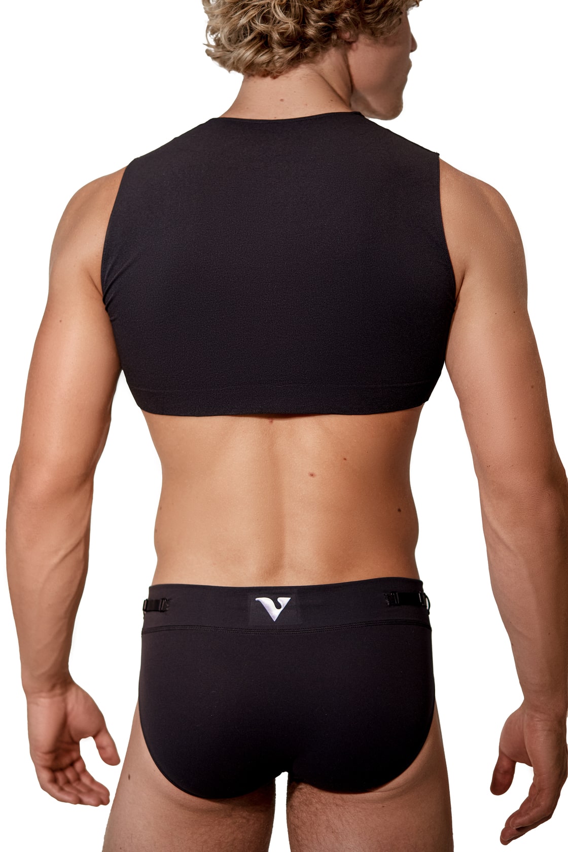 Model wearing the black Mini Crop Top with black briefs, back view — Color: Black