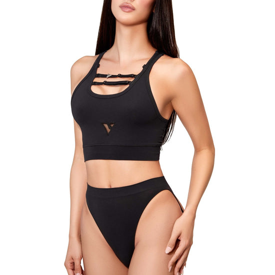 Model styling the black Compression Crop Top with black briefs, full front view — Color: Black